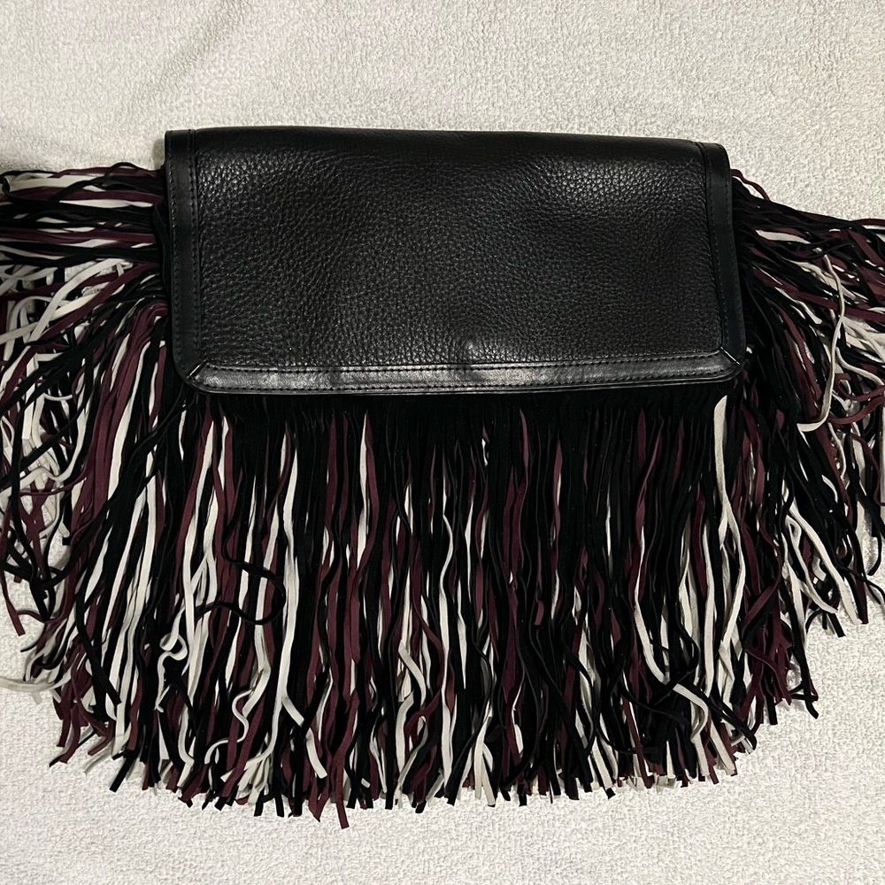 Sam Edelman black tassel clutch. Black/ white/ burgundy tassels. Brand new.